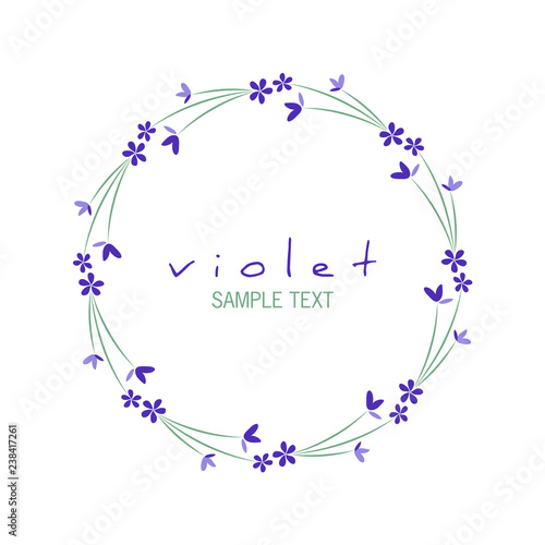 Round frame of wild violets isolated on white background photo