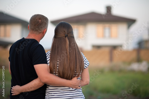 Couple looking at they's house