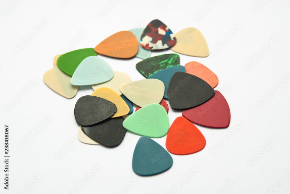 Colour guitar picks on the white background Colour guitar picks on the white background