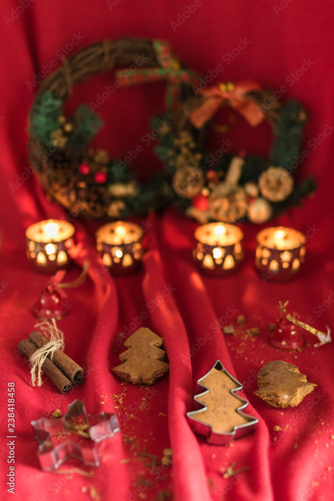 Fototapeta premium Christams decoration. Homemade Christmas tree shaped gingerbread cookies in the red mood. 