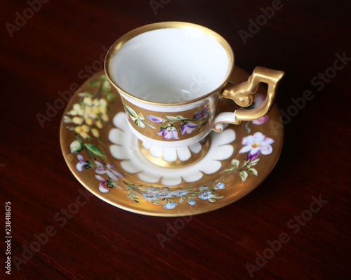 Romantic antique coffee cup with saucer in Biedermaier style  hand painted in gold and enamel with colorful flowers