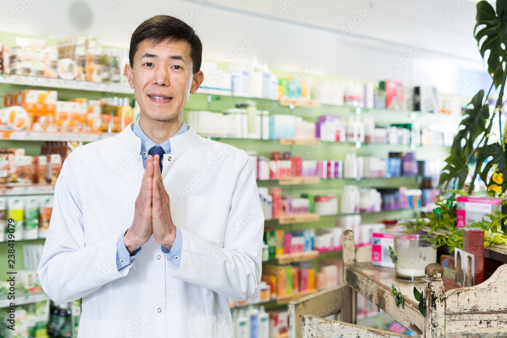 Fototapeta premium Cheerful korean man is standing with medicines