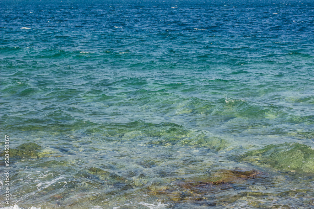 vivid transparent blue sea water with waves background surface, Mediterranean landscape in summer weather timebeach,coast,landscape,ambiance,background,storm,sea shore,blue water,sea water,water surfa vivid transparent blue sea water with waves background surface, Mediterranean landscape in summer weather timebeach,coast,landscape,ambiance,background,storm,sea shore,blue water,sea water,water surfa