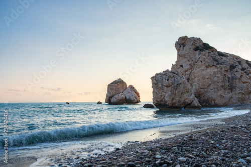 Afternoon view of breaking waves at the pebbly beach around Petra tou Romiou, also known as Aphrodite's birthplace, in Paphos, Cyprus.