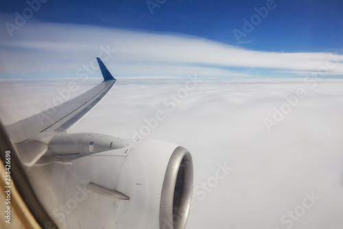 View of beautiful cloud and wing of airplane