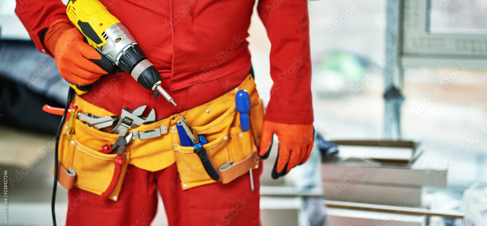 The builder makes repairs in the apartment. The builder makes repairs in the apartment.