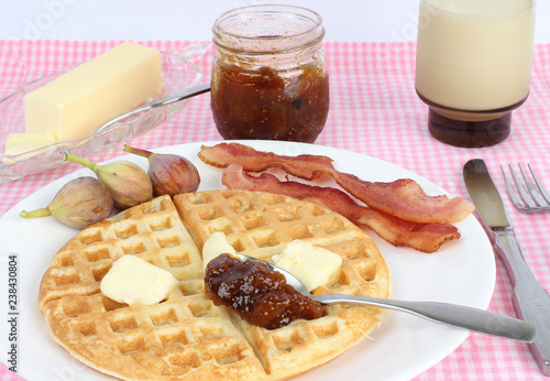 Breadfast Plate with Fig Preserve on Waffle and Bacon photo