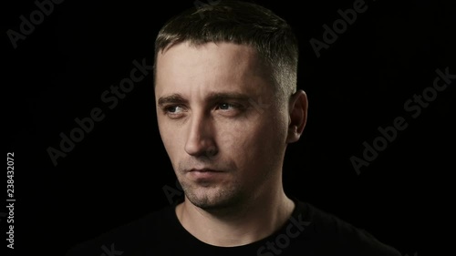 The man looking in camera