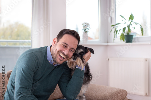 Man with dog on sofa