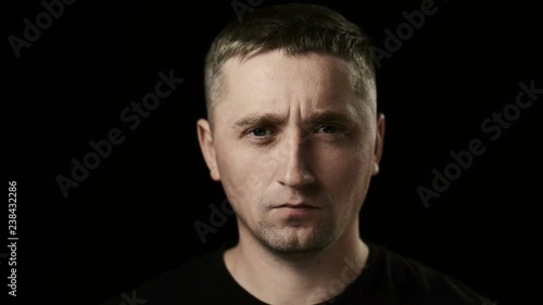 The man looking in camera