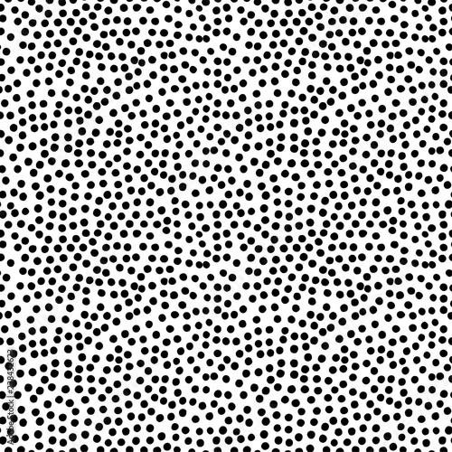 Black and white seamless polka dot pattern. Hand drawn vector ornament for wrapping paper. 