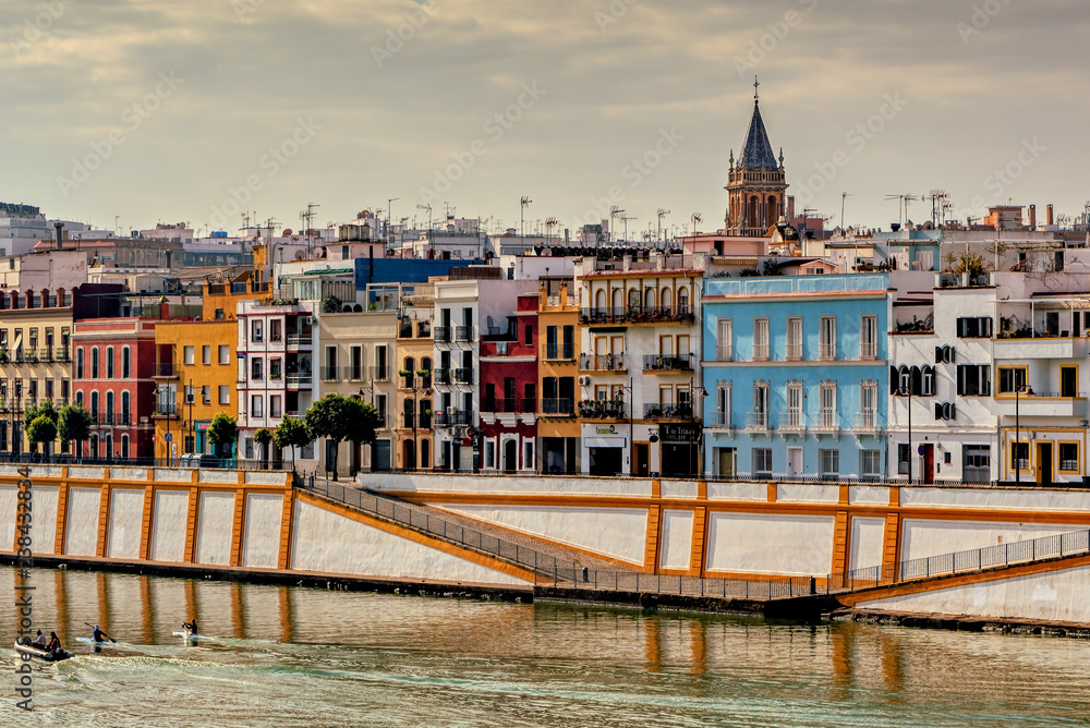 Colorful Triana neighborhood on the banks of Guadalquivir river in Seville, Spain.