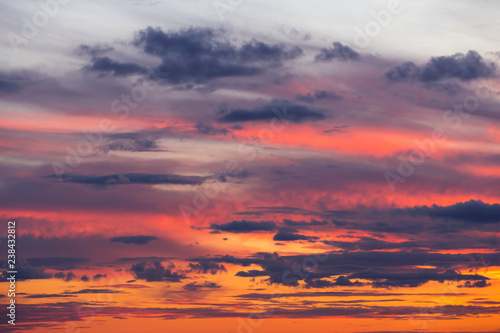 Beautiful dramatic sunset orange pink sky with clouds background © Viktor Iden
