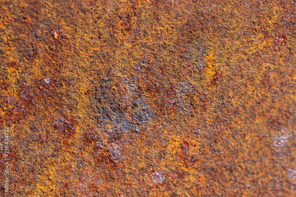 Rust on metallic surface. Rusted iron texture. Rusty metal background with copy space. Rough oxide plate close up. Strong rust. Hard decay of metal in macro. Oxidation of steel. Chemical reaction. Rust on metallic surface. Rusted iron texture. Rusty metal background with copy space. Rough oxide plate close up. Strong rust. Hard decay of metal in macro. Oxidation of steel. Chemical reaction.