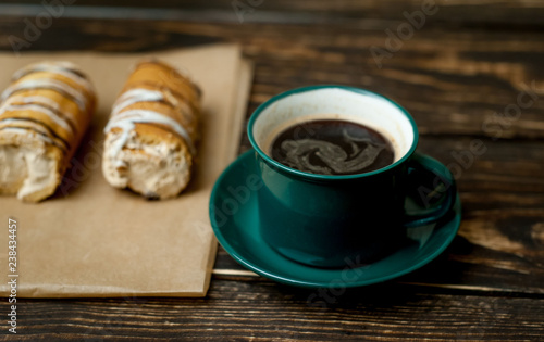 coffee mug and cake on wooden background
