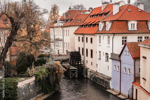 View of houses along the Devil's Channel from Charles Bridge, Prague, Czech Republic, Europe