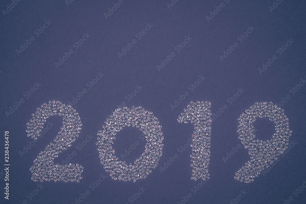 2019 of white sparkling strass decoration on blue background. 2019 of white sparkling strass decoration on blue background.