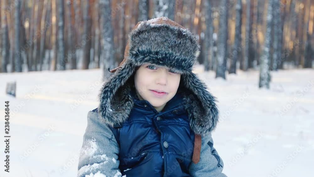 Portrait of a boy in winter hat. Smile. Winter concept Portrait of a boy in winter hat. Smile. Winter concept