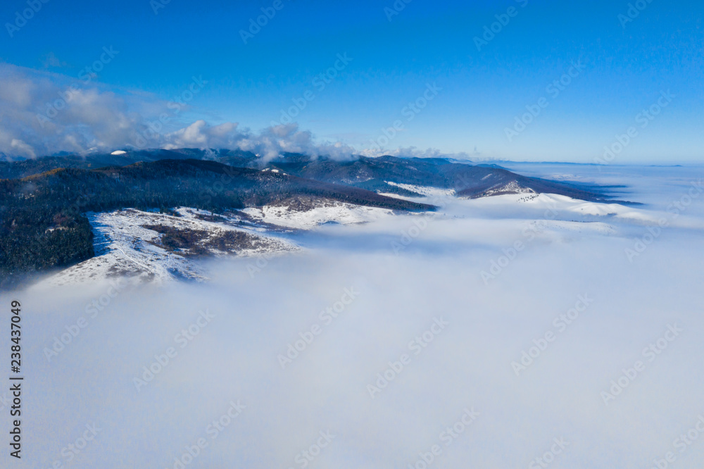 Morning mountain landscape with low clouds