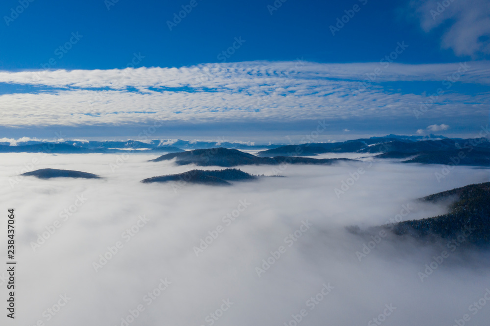 Low clouds in valley, aerial morning scene