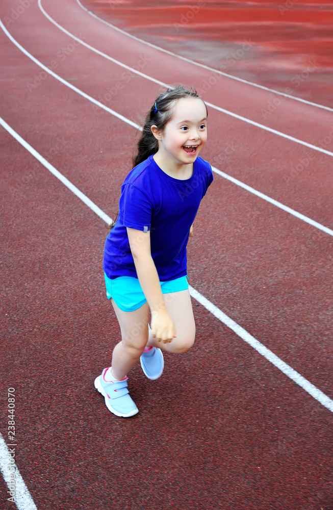 Little girl have fun on the stadium