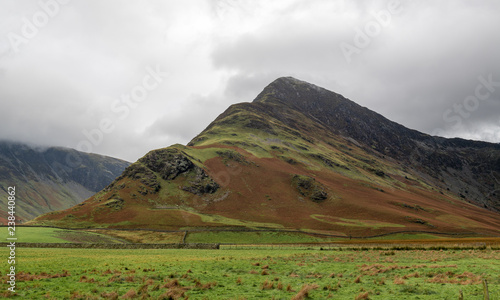 Hills surrounding Buttermere with autumn colors photo