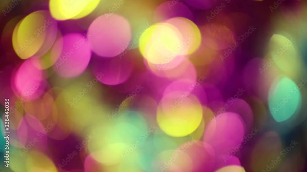 Defocused colourful bokeh abstract noel lights background of yellow, blue, purple colors isolated on black. Real time full hd video footage. Defocused colourful bokeh abstract noel lights background of yellow, blue, purple colors isolated on black. Real time full hd video footage.