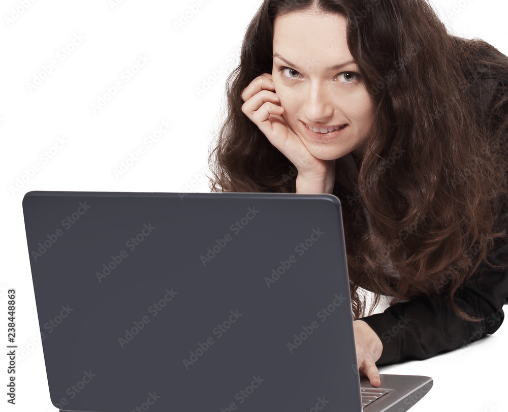 business woman working on laptop while lying on the floor. business woman working on laptop while lying on the floor.