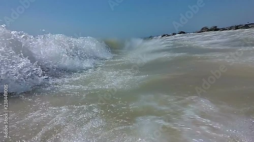 Rough Sea Loop. A loop of big waves in an agitated ocean. Camera goes underwater several times. Slow motion. Video from action camera.