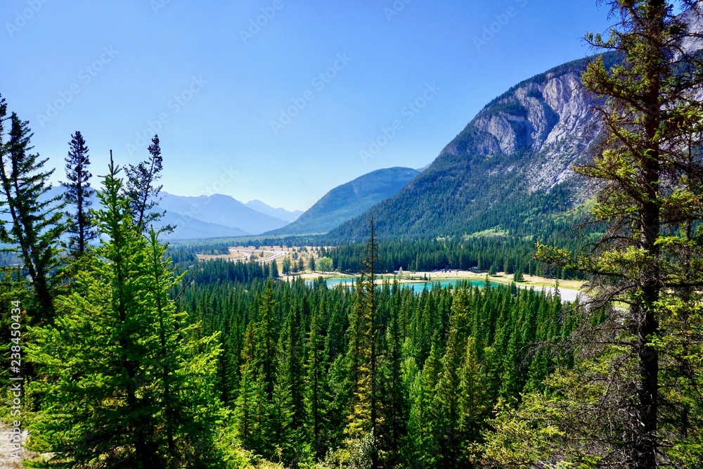 Elevated view of Trans Canada Highway leading past Cascade Ponds into Banff National Park