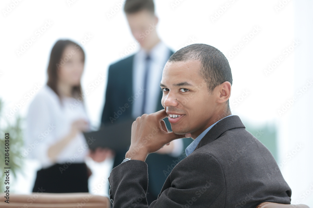 closeup .a successful businessman on blurred background closeup .a successful businessman on blurred background