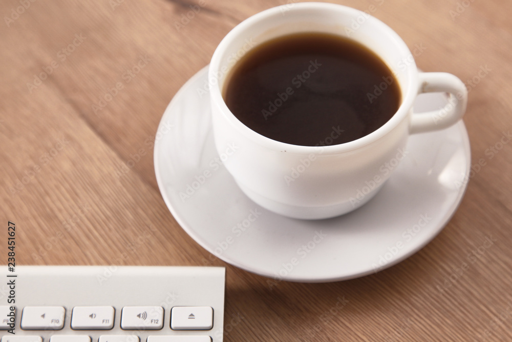 A cup of coffee on the office table A cup of coffee on the office table