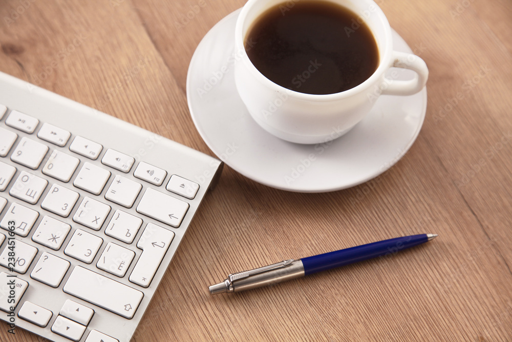 A cup of coffee on the office table A cup of coffee on the office table