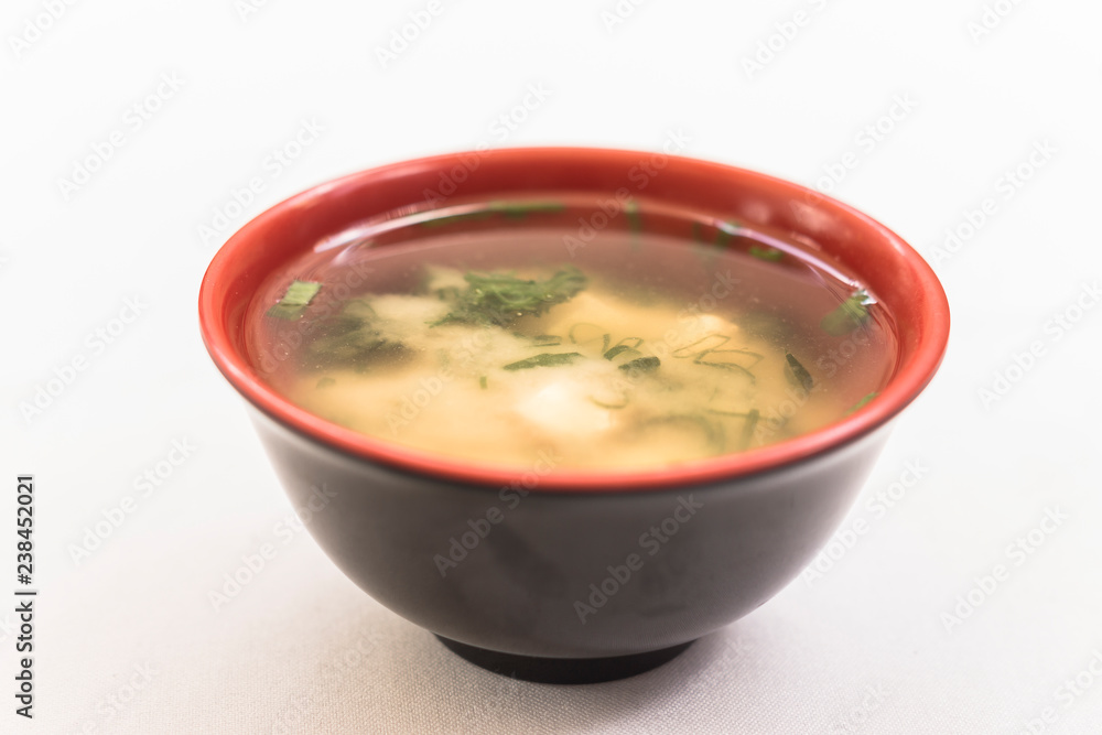 Black and red bowl with missoshiro on white background