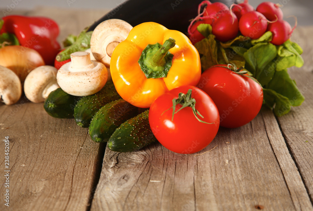 Composition with assorted raw organic vegetables wooden table Composition with assorted raw organic vegetables wooden table