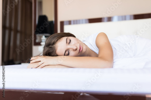 Beautiful young woman sleep on the bed at home