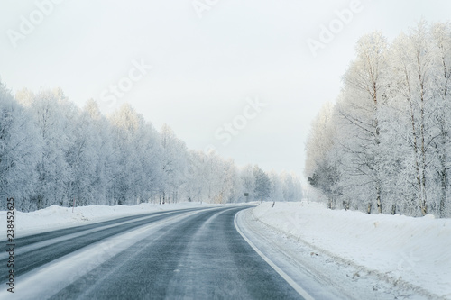 Winter road and a Snowy Forest at Cold Finland
