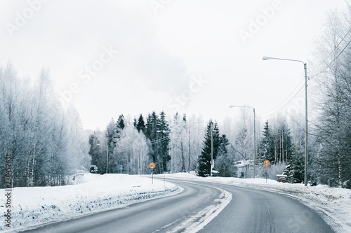 Winter road and a Snowy Forest in Cold Finland