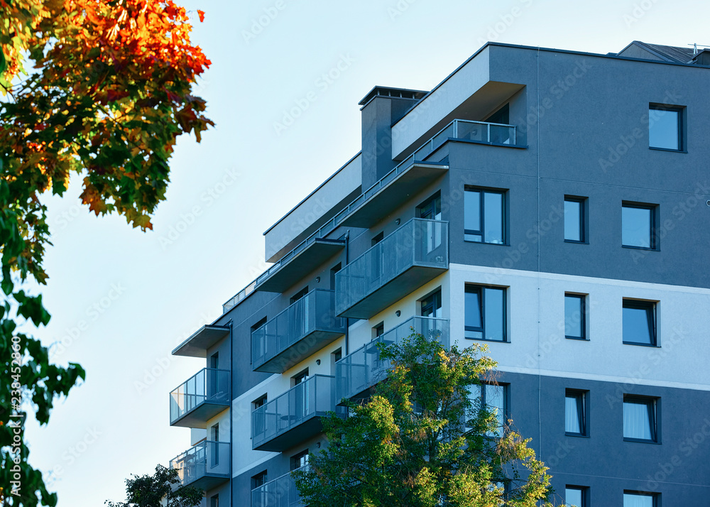 Facade of modern apartment house copy space autumn tree Facade of modern apartment house copy space autumn tree