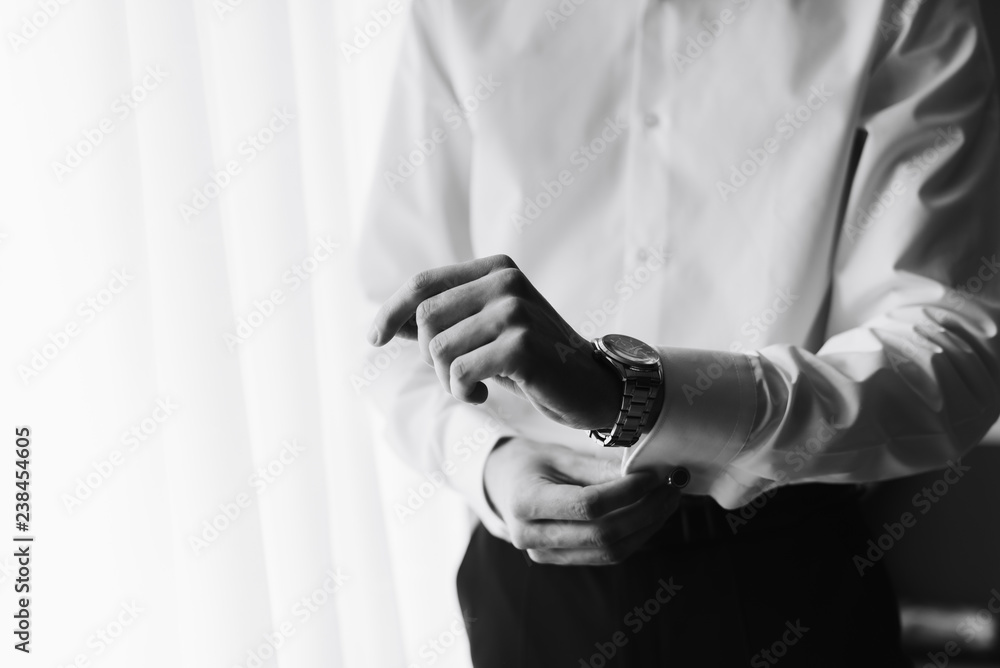 the morning of the groom, a handsome guy in a suit with a bow tie the morning of the groom, a handsome guy in a suit with a bow tie