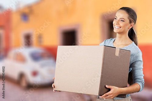 Woman moving into new house isolated on white