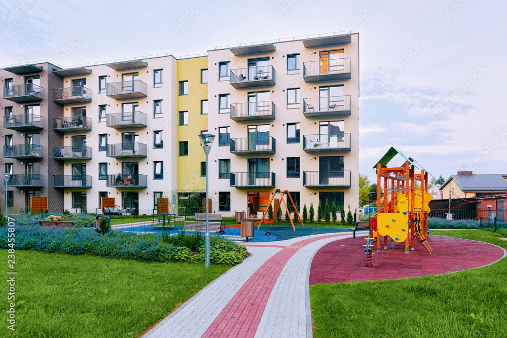 Fototapeta premium Modern house new residential apartment building exterior children playground