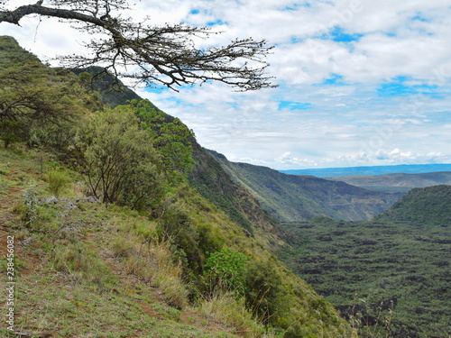 Hiking along the volcanic crater of Mount Suswa, Rift Valley, Kenya photo