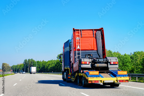 Truck transporter carrying lorry cabin in highway road in Slovenia