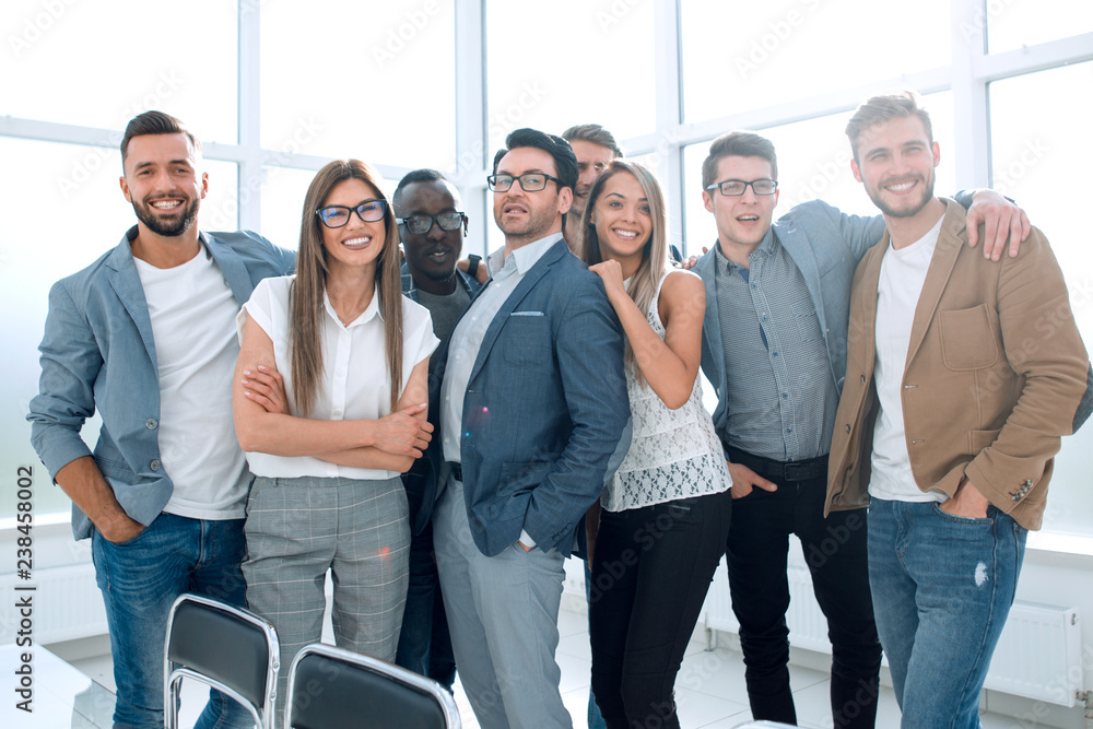 portrait of a professional business team standing in a modern office