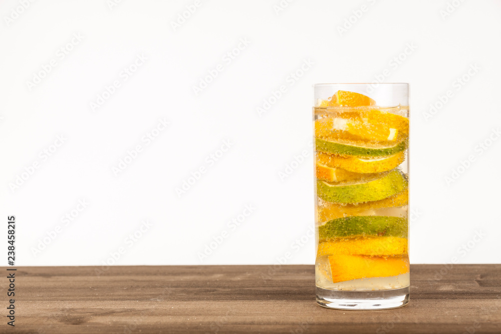 Fresh lemonade in high glass on a wooden surface Fresh lemonade in high glass on a wooden surface