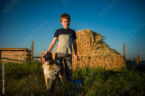 Wallpaper Mural Portrait of boy with dog standing in field Torontodigital.ca