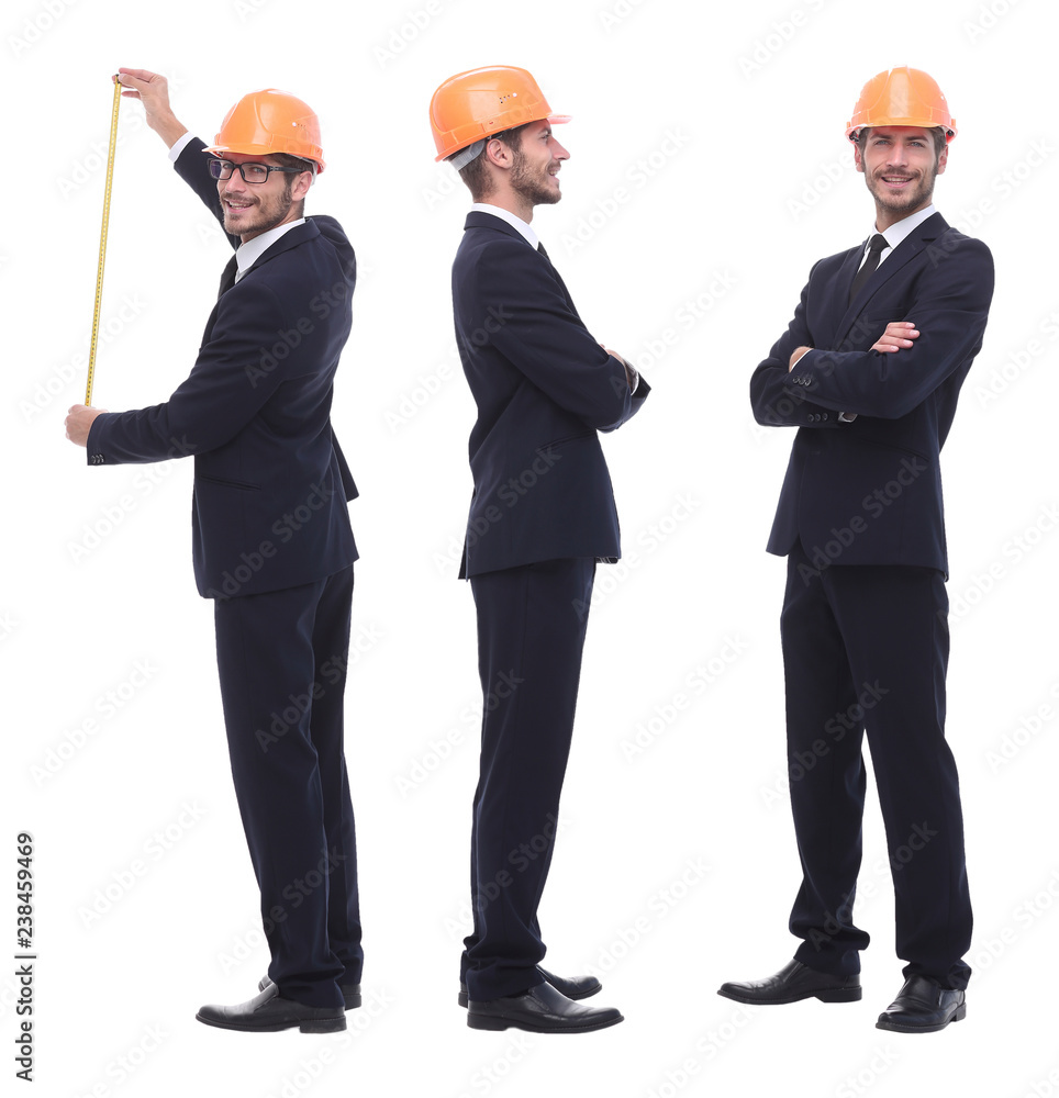 in full growth .a qualified architect in an orange helmet in full growth .a qualified architect in an orange helmet