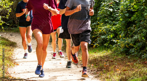 Group of runners on a dirt trail running