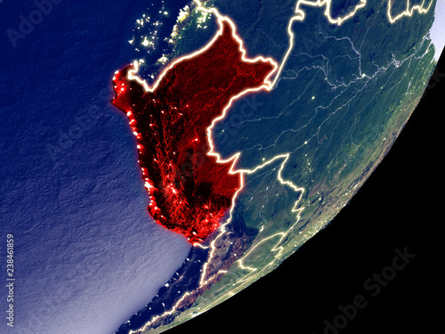 Peru from space on model of Earth at night. Very fine detail of the plastic planet surface and visible bright city lights.